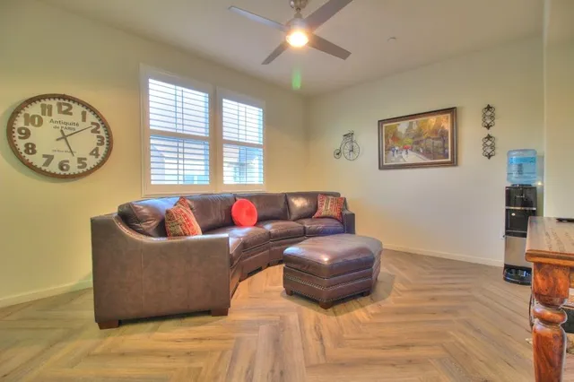 a living room with furniture and a window