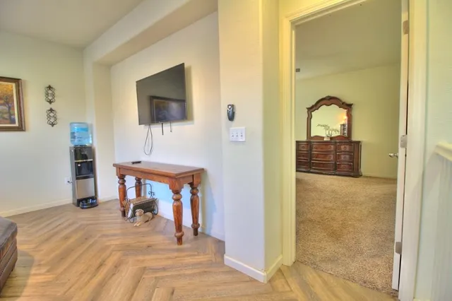 a bedroom with a bed and a table in it