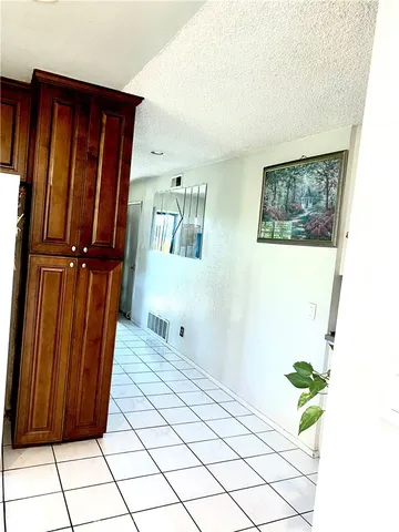 a kitchen with granite countertop a sink and a counter top space