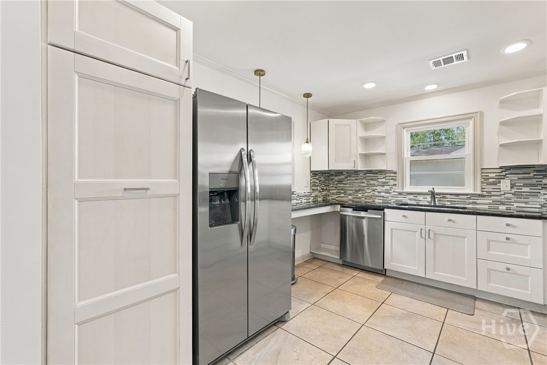 209 Brandywine Road Savannah, GA 31405 - Photo 16 of 45 KITCHEN W/WHITE ABUNDANT CABINETRY