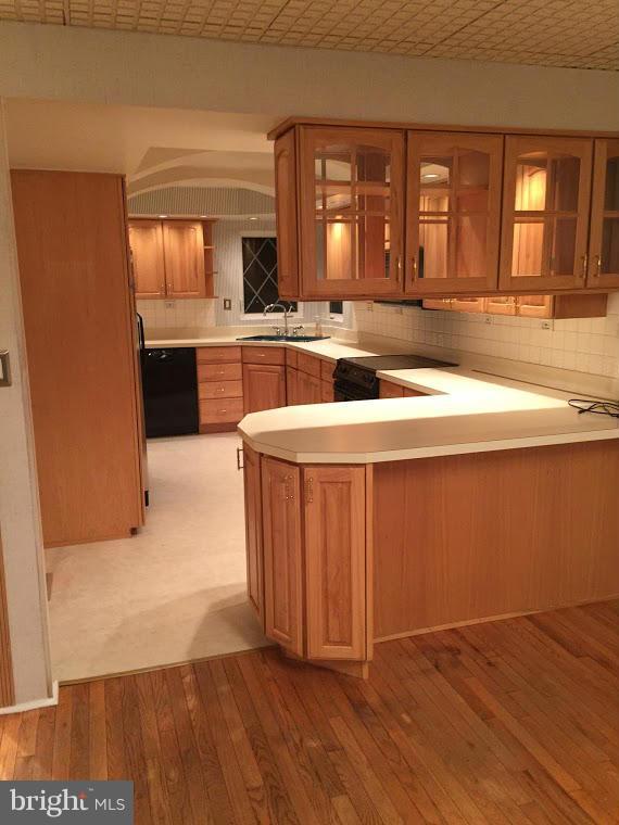 1206 3rd Road Middle River, MD 21220 - Photo 4 of 19 a large kitchen with kitchen island granite countertop wooden cabinets a sink and dishwasher