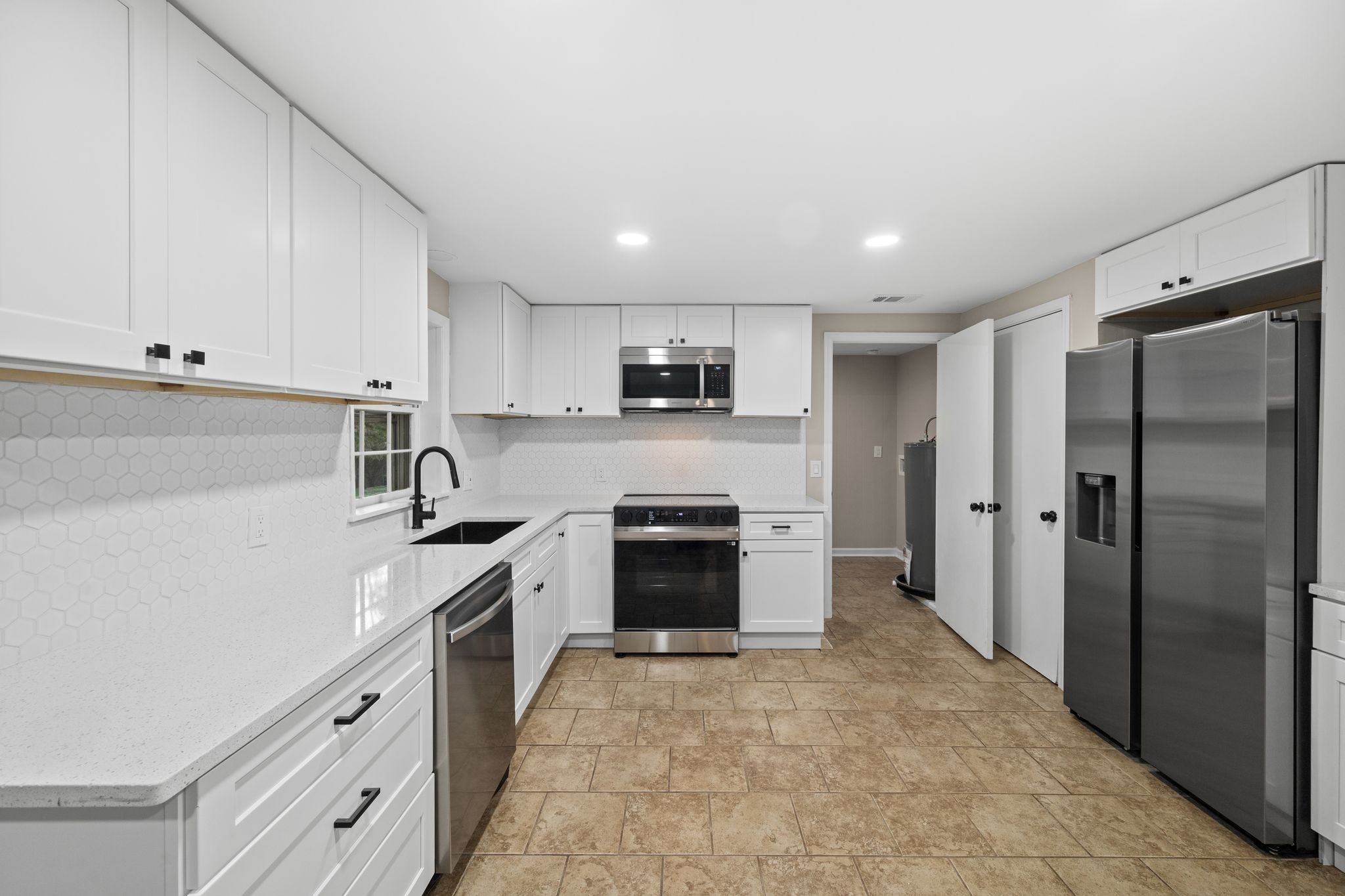 133 Mockerson Road Leoma, TN 38468 - Photo 15 of 33 a kitchen with stainless steel appliances granite countertop a refrigerator and a stove top oven