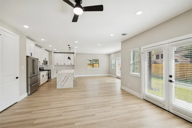 a view of a living room kitchen and a window