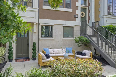 a front view of a house with outdoor seating