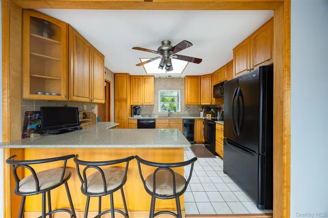 a view of a kitchen with furniture and a kitchen