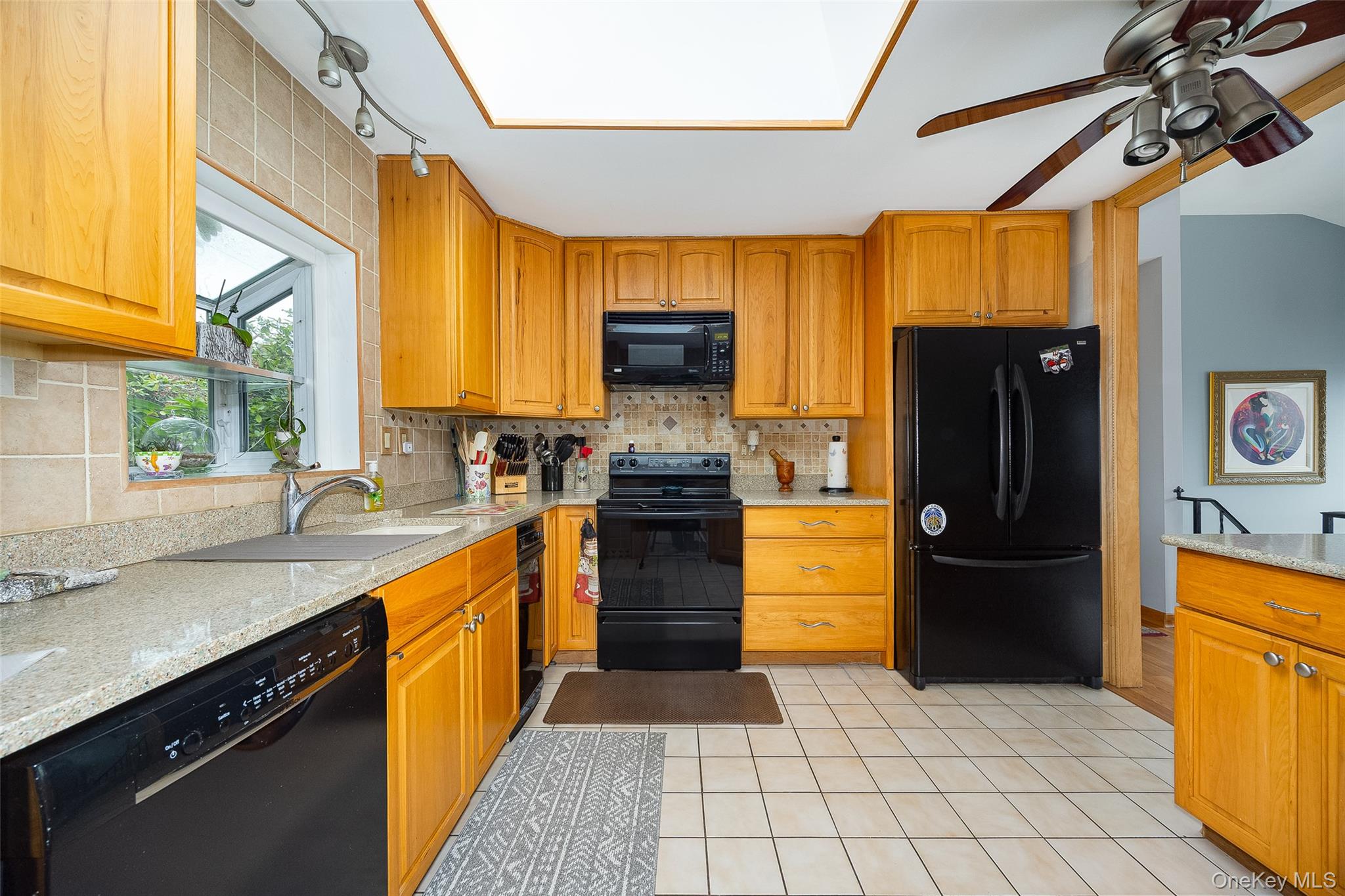 21 North Gate Road Carmel, NY 10512 - Photo 17 of 31 a kitchen with a refrigerator and a sink