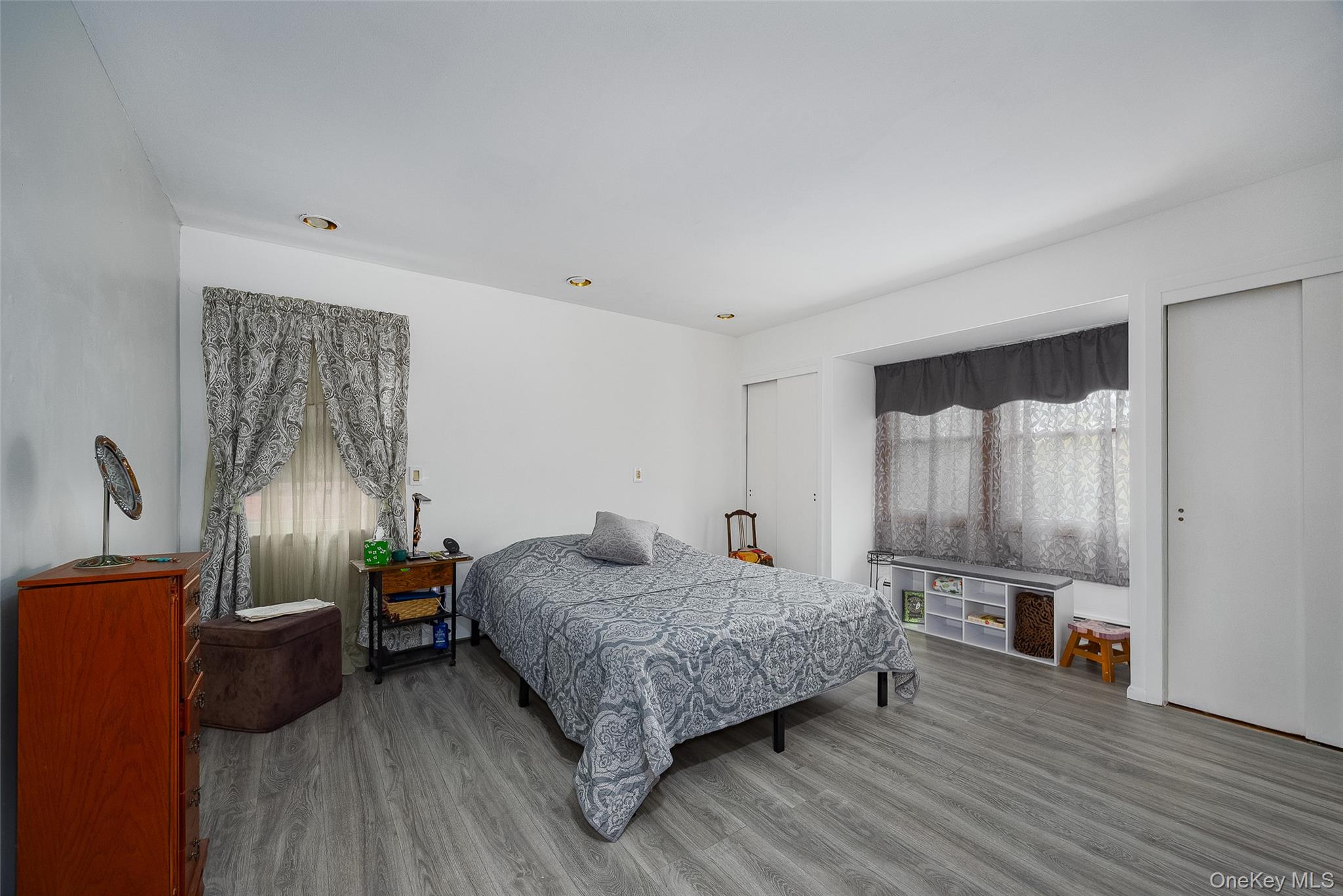 21 North Gate Road Carmel, NY 10512 - Photo 20 of 31 a bedroom with a bed and wooden floor