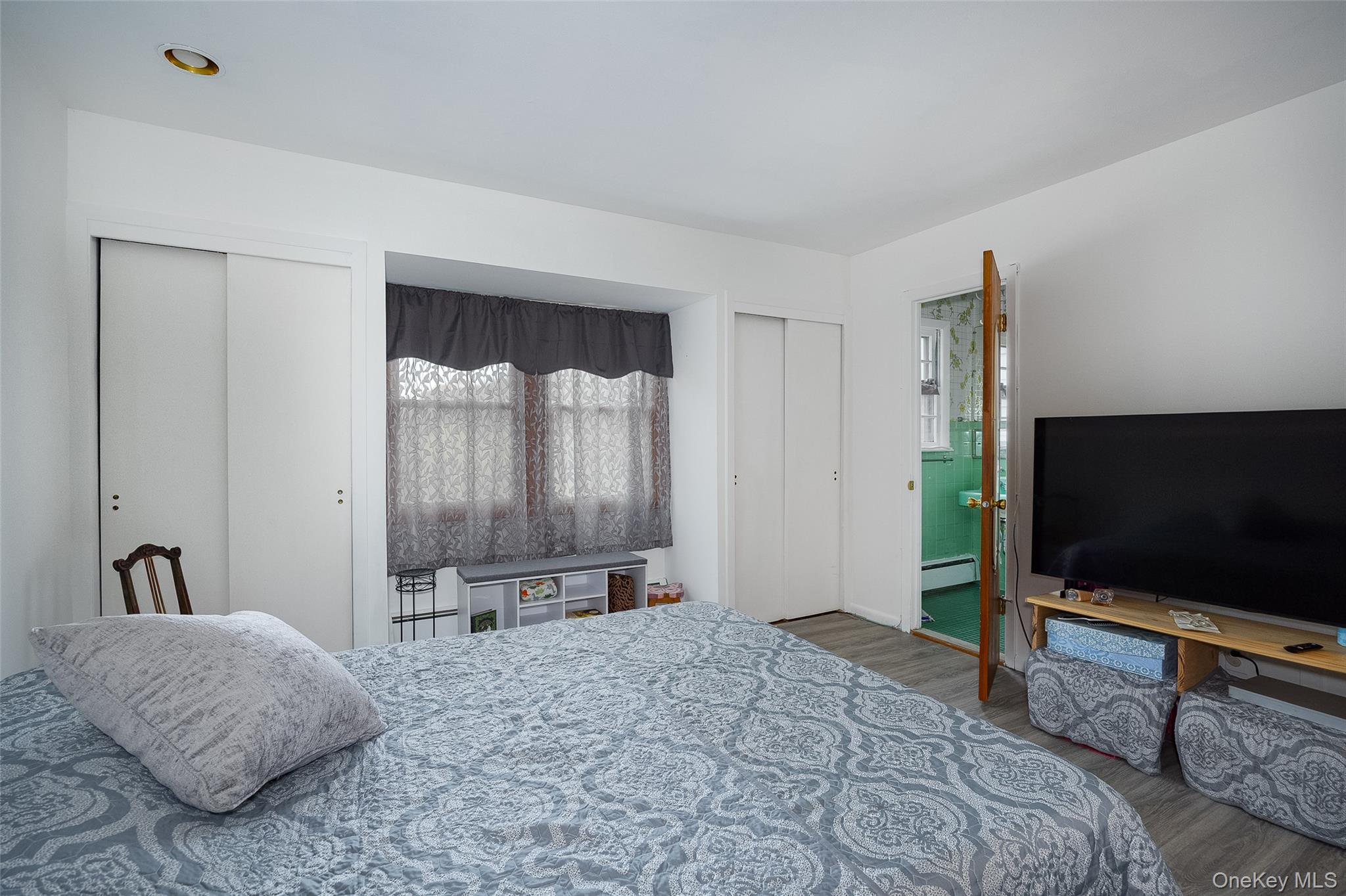 21 North Gate Road Carmel, NY 10512 - Photo 21 of 31 a bedroom with a bed and a flat screen tv