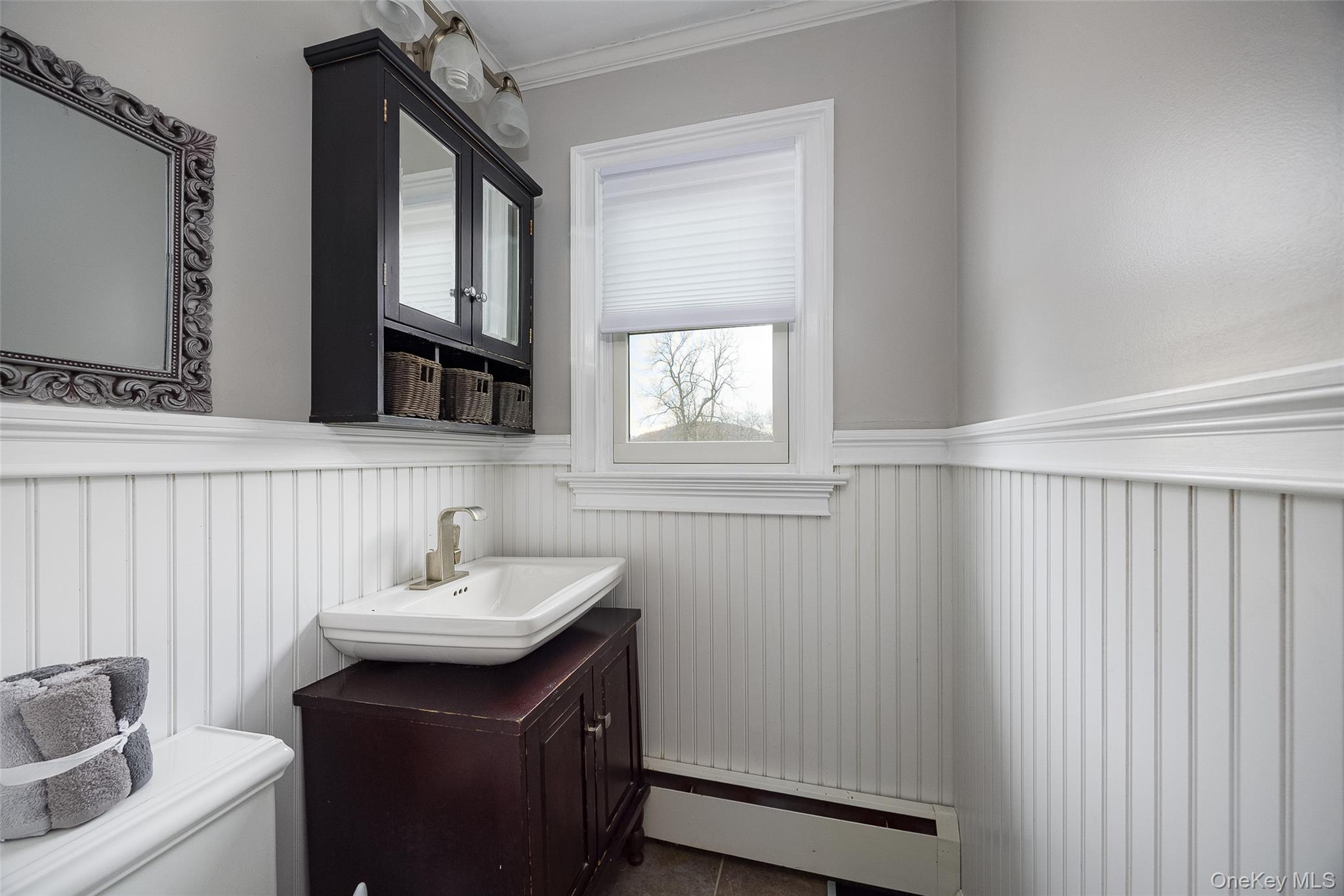 21 North Gate Road Carmel, NY 10512 - Photo 23 of 31 a bathroom with a sink and a mirror