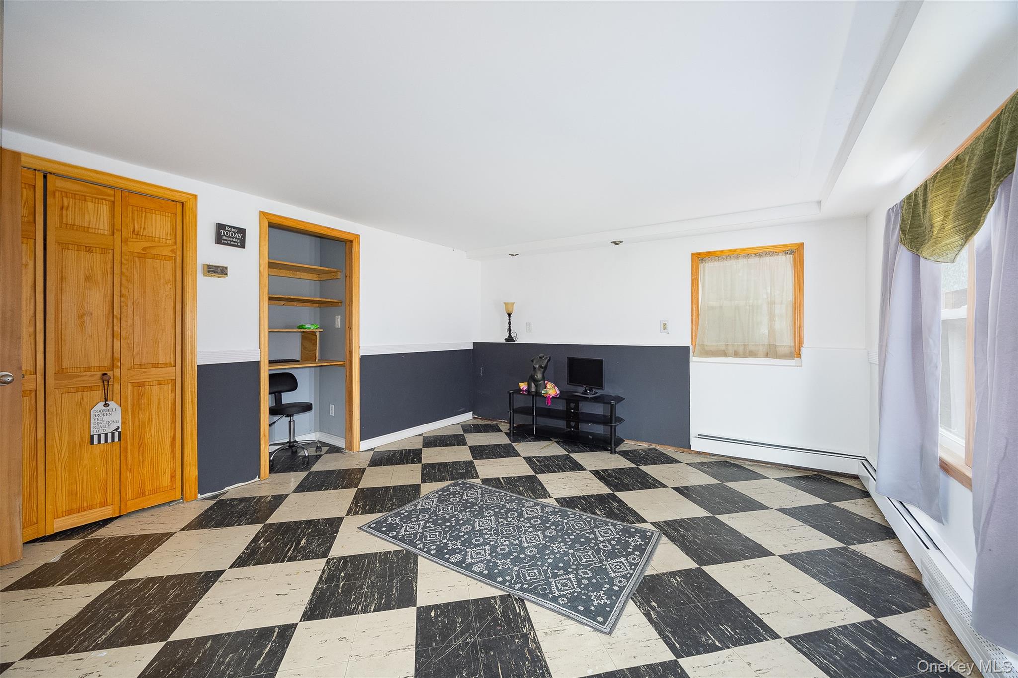 21 North Gate Road Carmel, NY 10512 - Photo 31 of 31 a room with a black white checkered floor with a rug and a rug