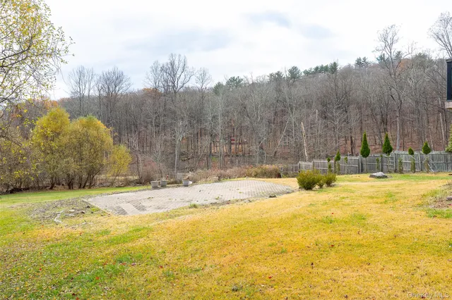 a view of deck of house with outdoor seating