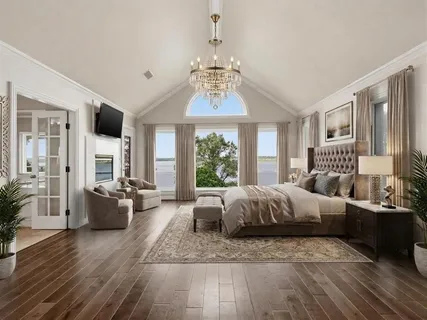 a living room with furniture a pool table and a large window