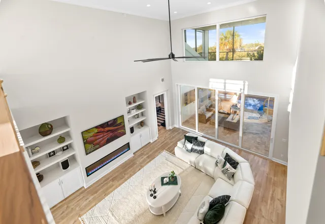 a living room with furniture and a potted plant