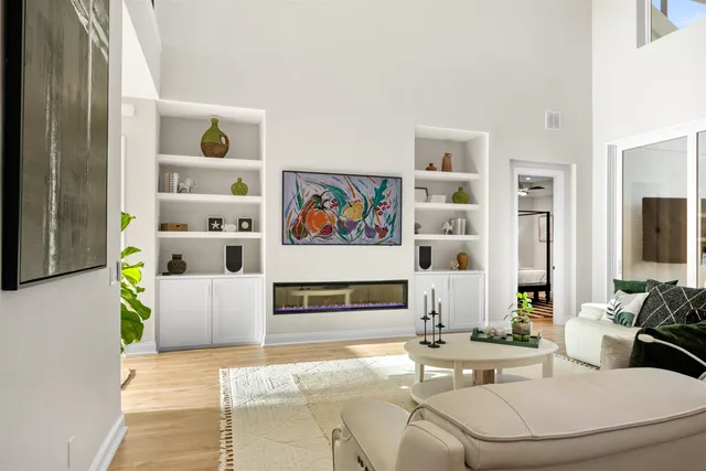 a spacious bathroom with double sink and a mirror