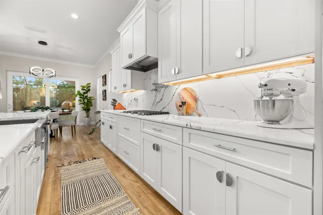 a view of an entryway with wooden floor