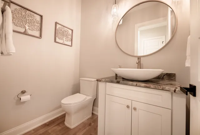 a view of a balcony with two couches and wooden floor