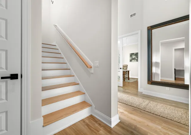 a view of a patio with swimming pool table and chairs