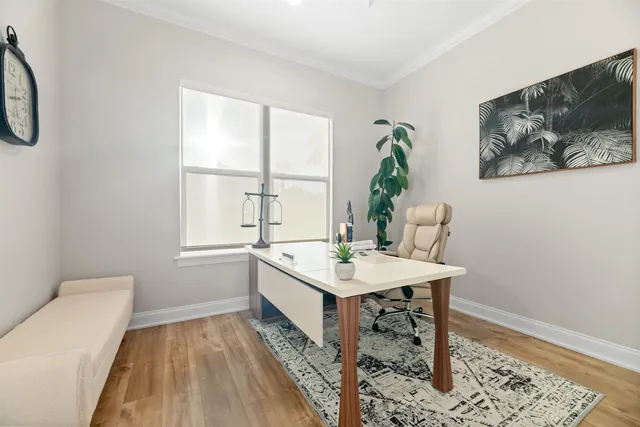 a living room with furniture and a floor to ceiling window