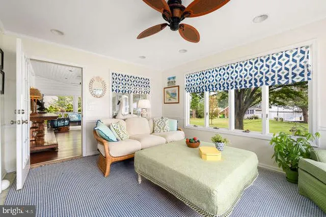 a dining room with furniture window and wooden floor