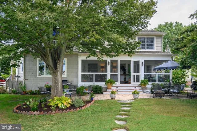 a view of a lake with boats and trees in the background