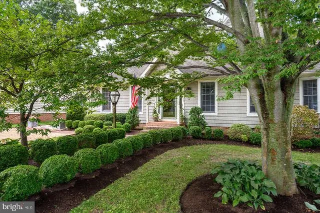 a front view of a house with garden
