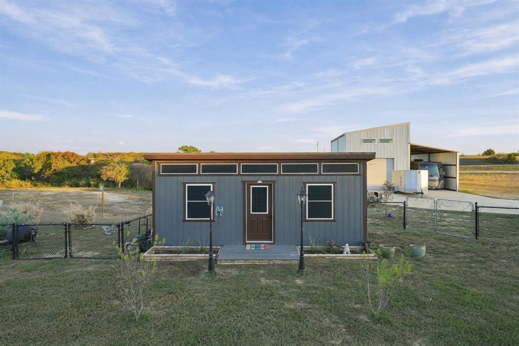 122 Nicholas Way Decatur, TX 76234 - Photo 21 of 26 Multi-use building, Large detached garage with loft, Covered RV storage