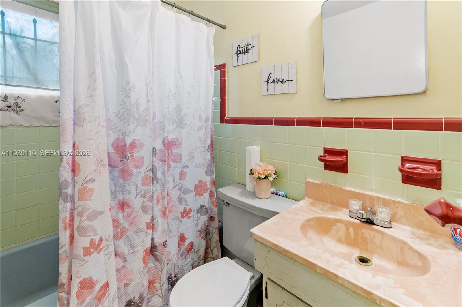 115 Southwest Lee Avenue Madison, FL 32340 - Photo 12 of 17 a bathroom with a sink toilet and a mirror