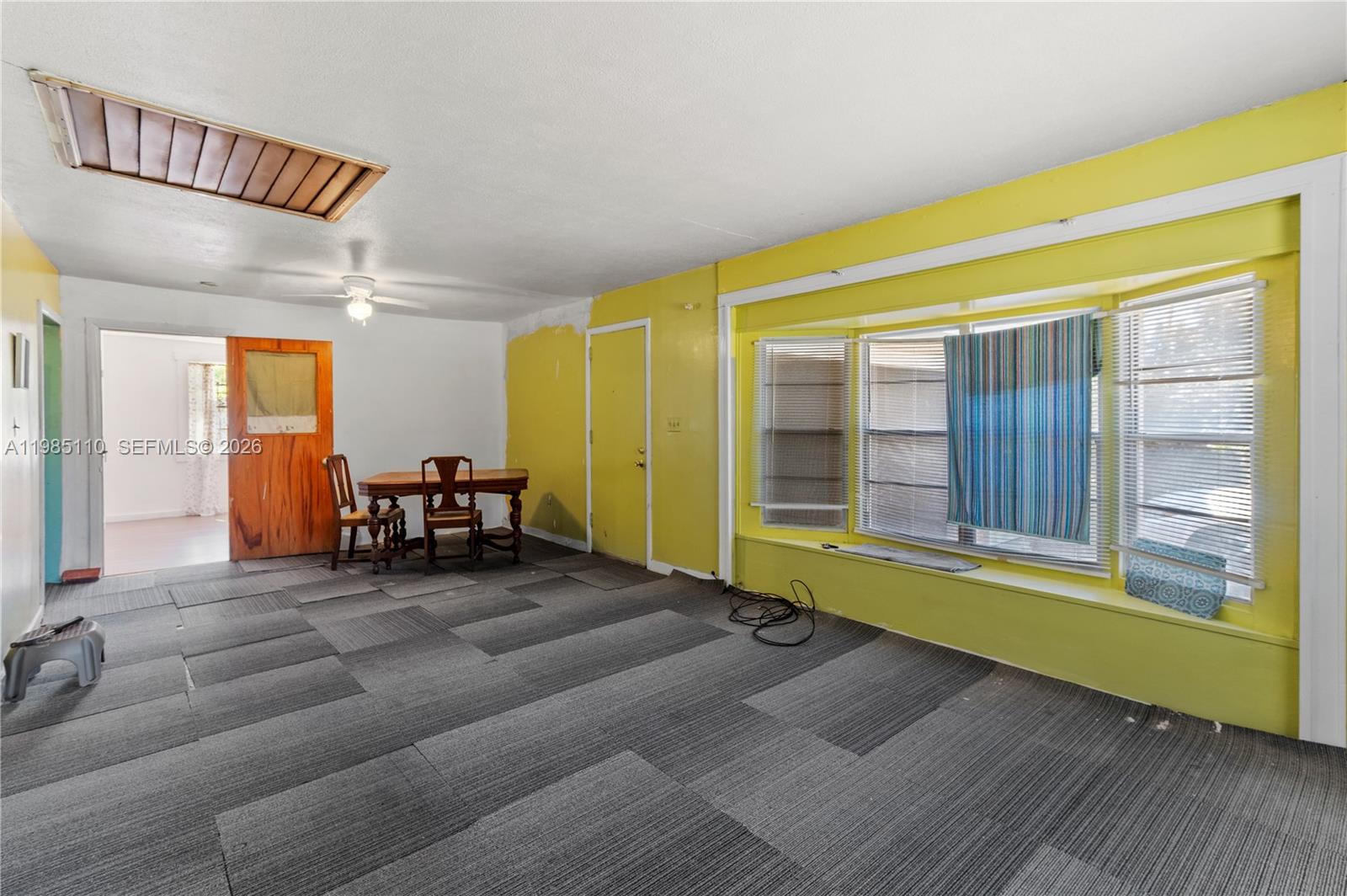 115 Southwest Lee Avenue Madison, FL 32340 - Photo 7 of 17 a living room with furniture and a large window