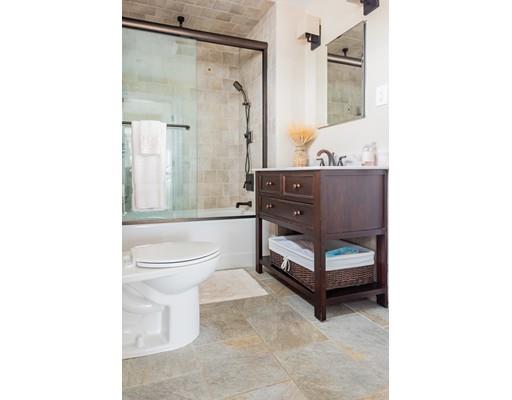 140 Fort Point Road Weymouth, MA 02191 - Photo 14 of 24 a bathroom with a toilet a sink and a bathtub