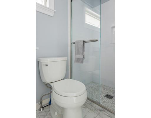 140 Fort Point Road Weymouth, MA 02191 - Photo 18 of 24 a white toilet sitting next to a bathroom sink