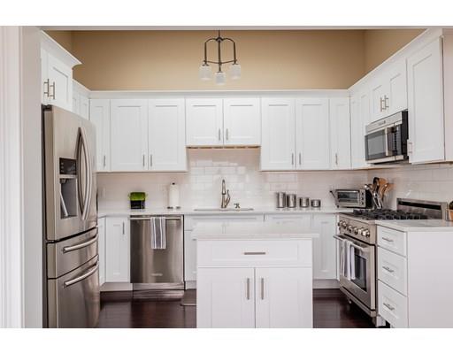 140 Fort Point Road Weymouth, MA 02191 - Photo 10 of 24 a kitchen with stainless steel appliances granite countertop a refrigerator sink and cabinets