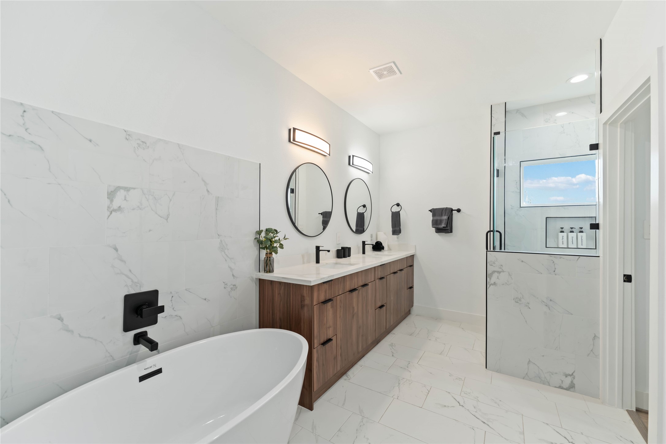 3034 Gray Street, Unit B Houston, TX 77004 - Photo 12 of 23 a bathroom with a tub sink and mirror