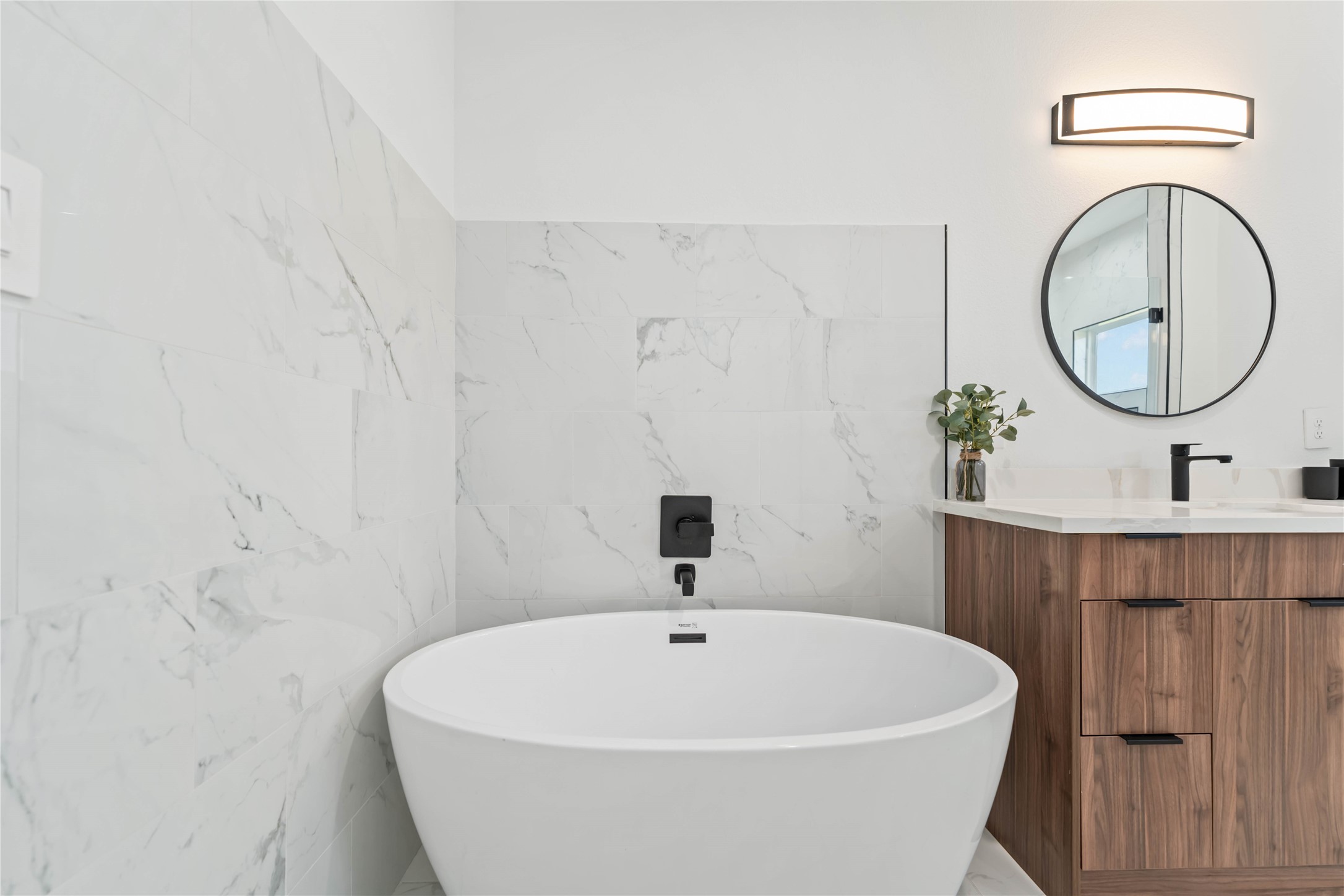 3034 Gray Street, Unit B Houston, TX 77004 - Photo 14 of 23 a white bath tub sitting in a bathroom