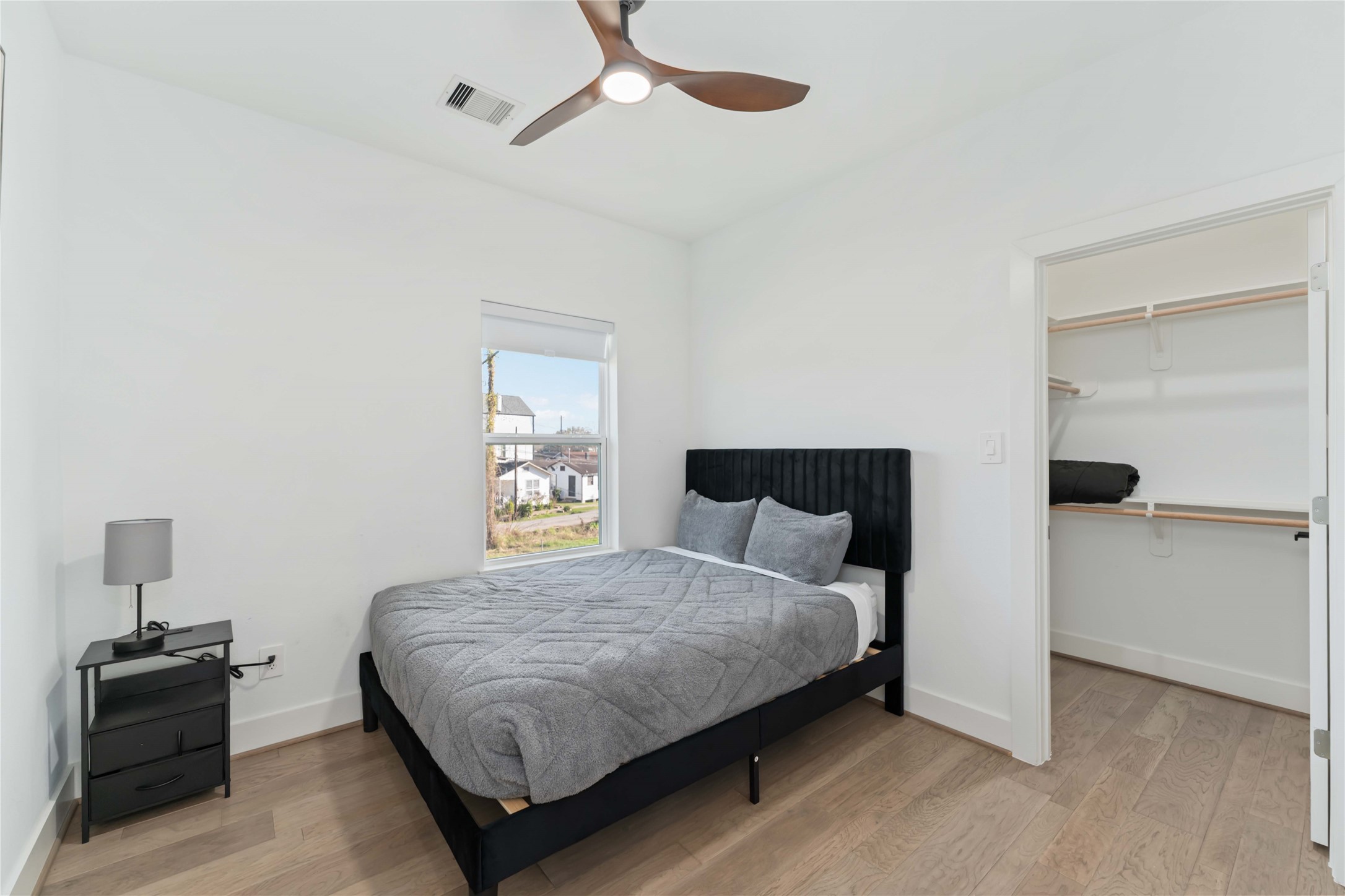 3034 Gray Street, Unit B Houston, TX 77004 - Photo 21 of 23 a bedroom with a bed and a window