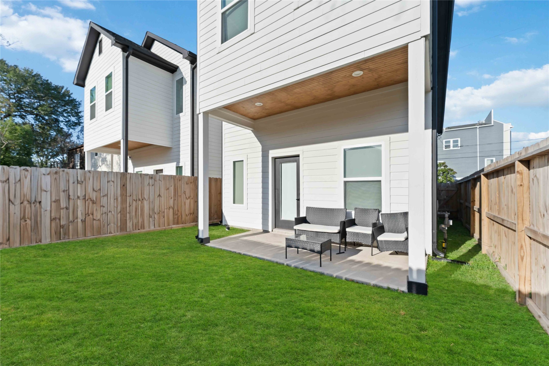 3034 Gray Street, Unit B Houston, TX 77004 - Photo 23 of 23 a view of a patio with couches chairs and a yard