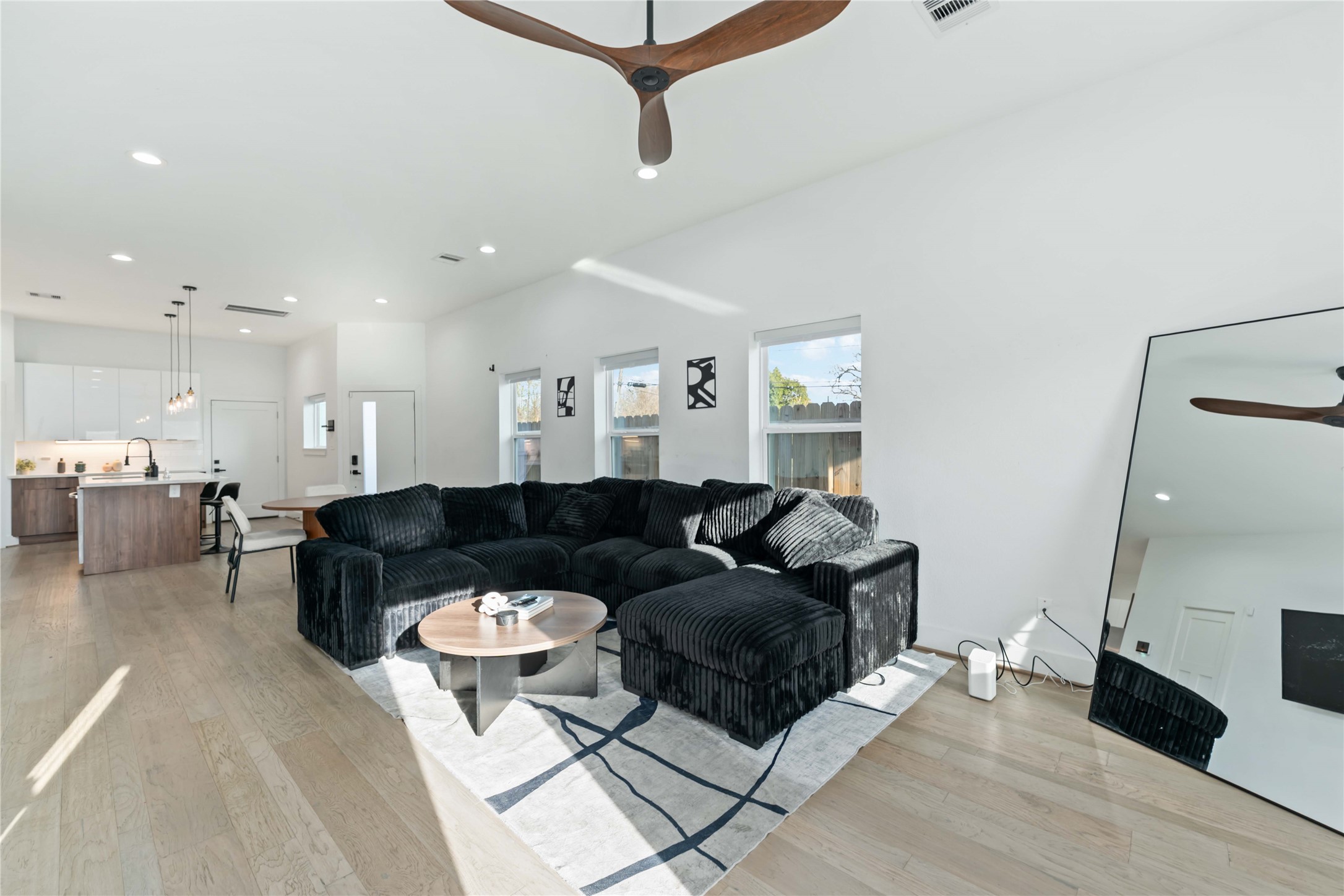 3034 Gray Street, Unit B Houston, TX 77004 - Photo 6 of 23 a living room with furniture and a view of kitchen