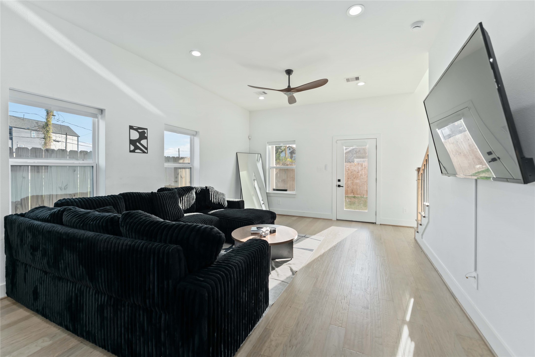 3034 Gray Street, Unit B Houston, TX 77004 - Photo 7 of 23 a living room with furniture and a window