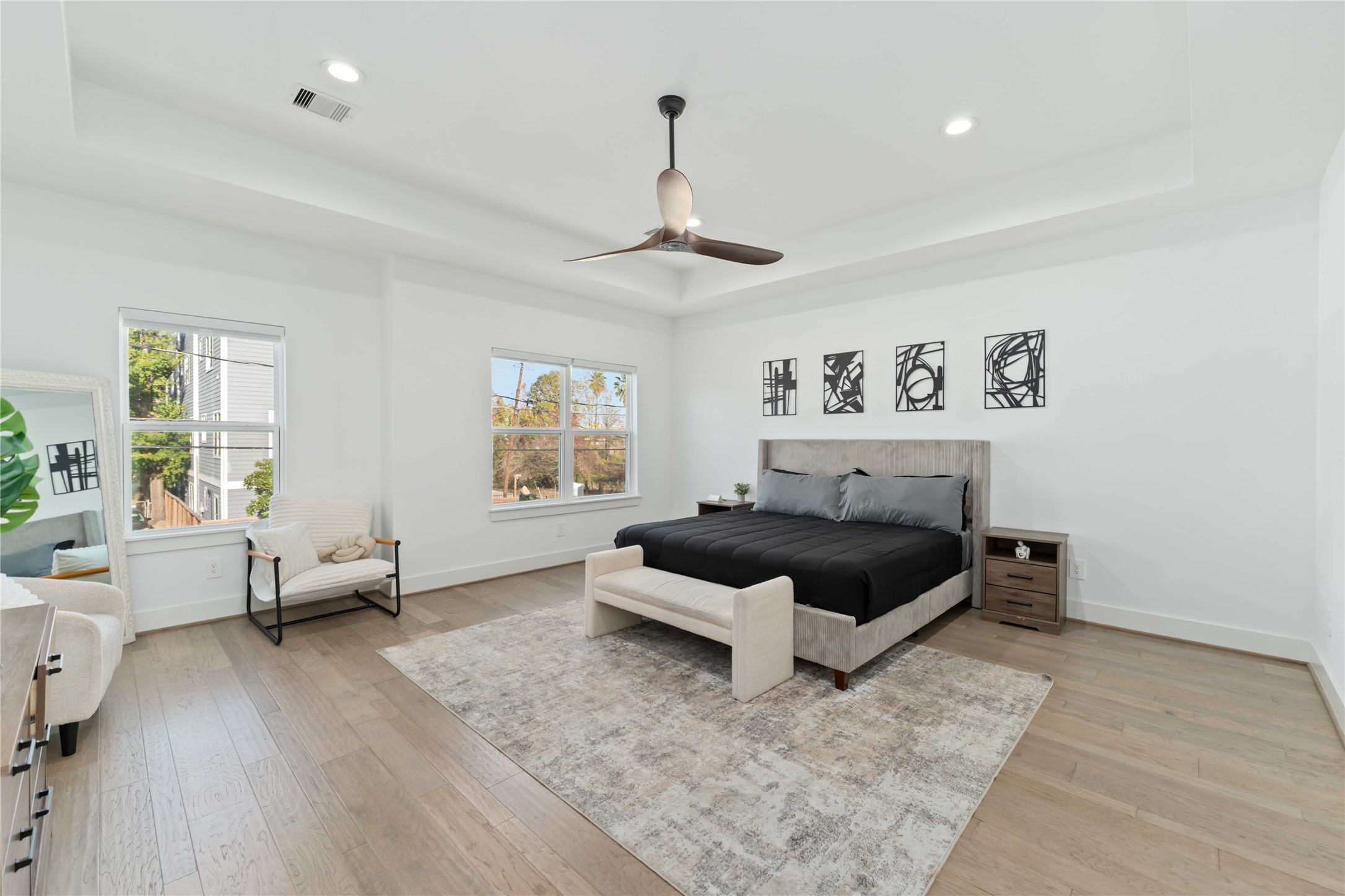 3034 Gray Street, Unit B Houston, TX 77004 - Photo 10 of 23 a bedroom with a bed and wooden floor