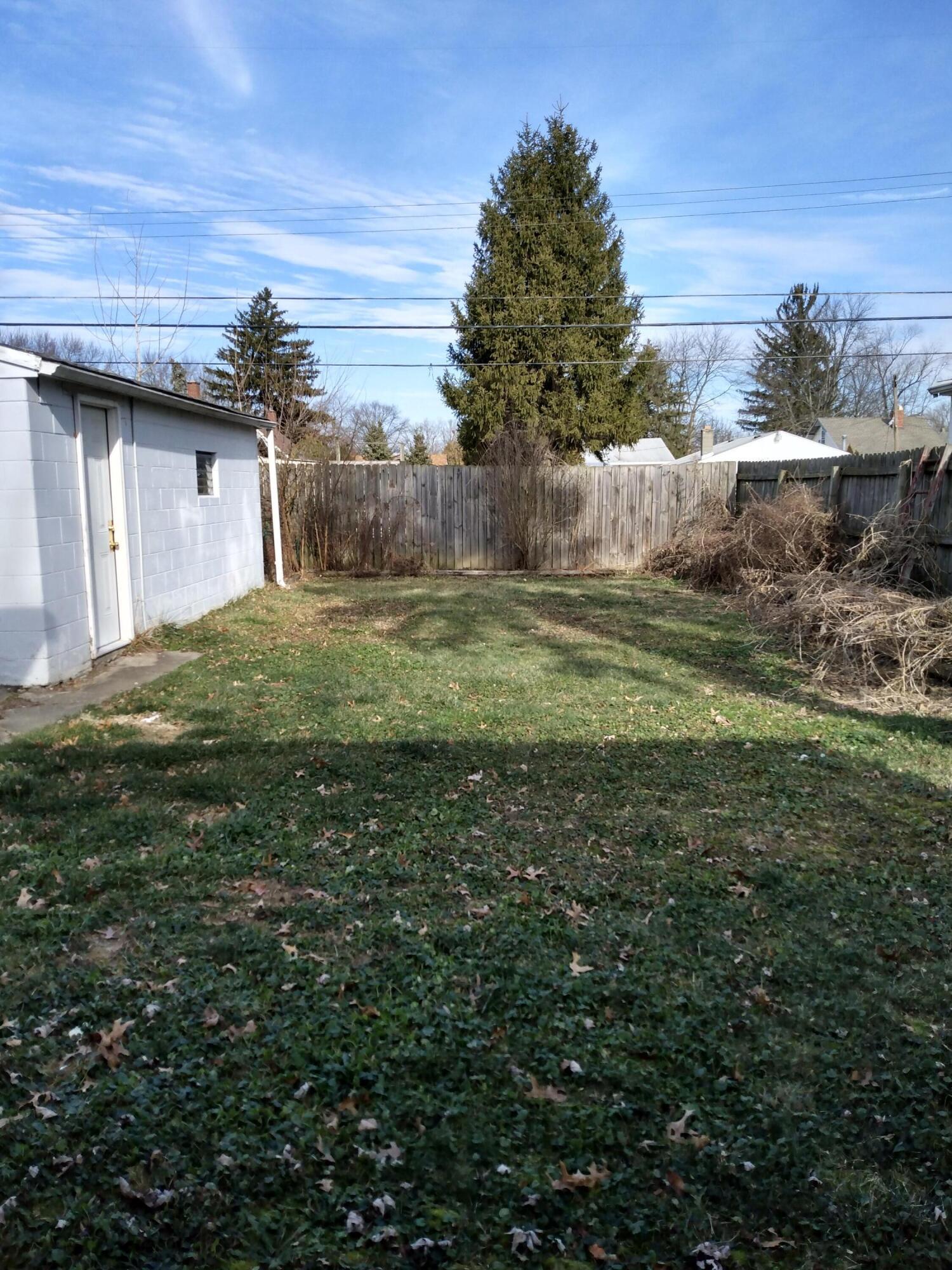 1906 Ward Road Columbus, OH 43224 - Photo 21 of 21 Fenced back yard with raised beds around the perimeter.