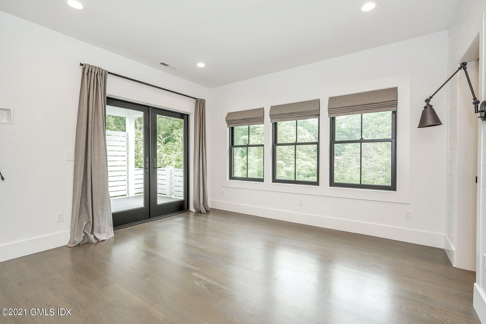 22 Wescott Street Riverside, CT 06878 - Photo 15 of 37 an empty room with wooden floor and windows