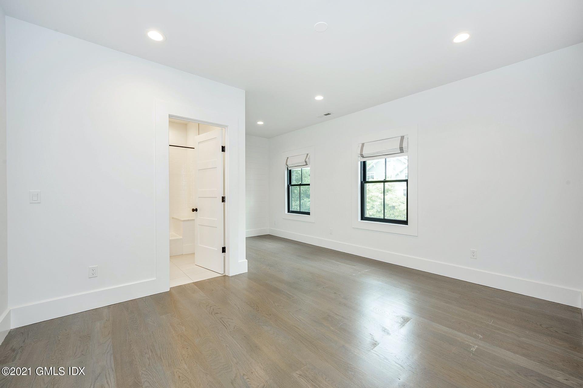 22 Wescott Street Riverside, CT 06878 - Photo 20 of 37 an empty room with wooden floor and windows