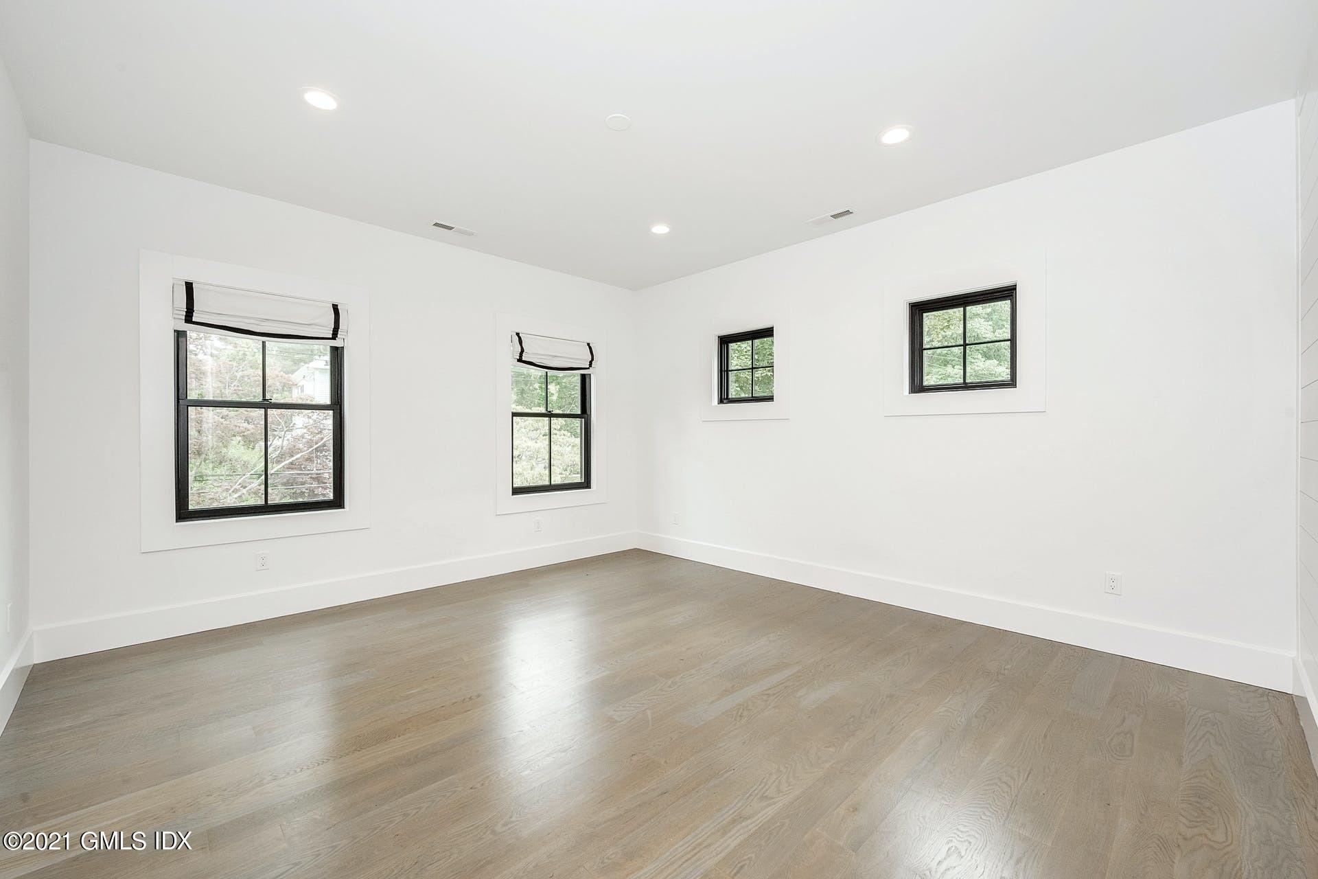 22 Wescott Street Riverside, CT 06878 - Photo 21 of 37 an empty room with wooden floor and windows