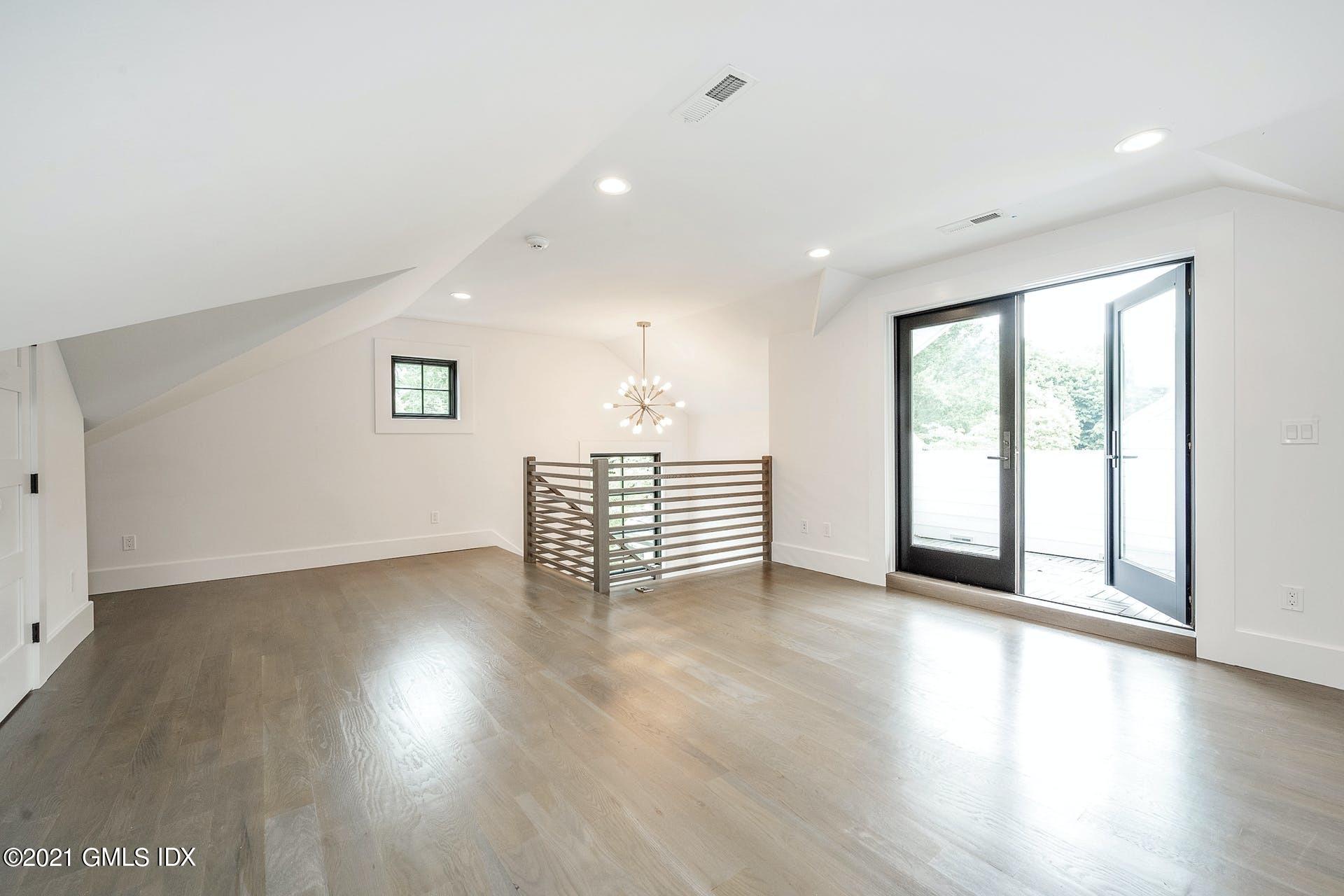 22 Wescott Street Riverside, CT 06878 - Photo 24 of 37 a view of an empty room with wooden floor and a window