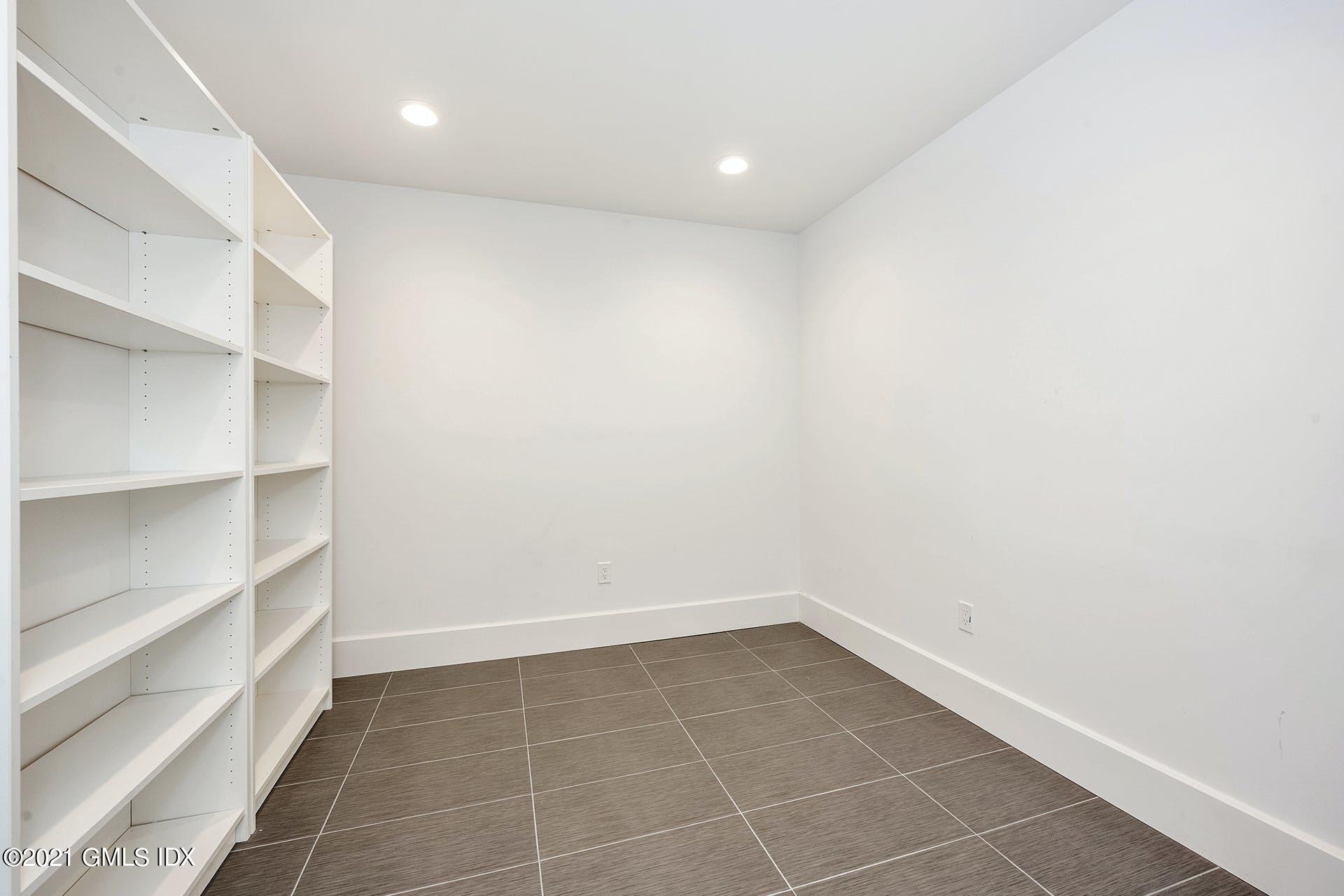 22 Wescott Street Riverside, CT 06878 - Photo 29 of 37 a view of an empty room with empty racks