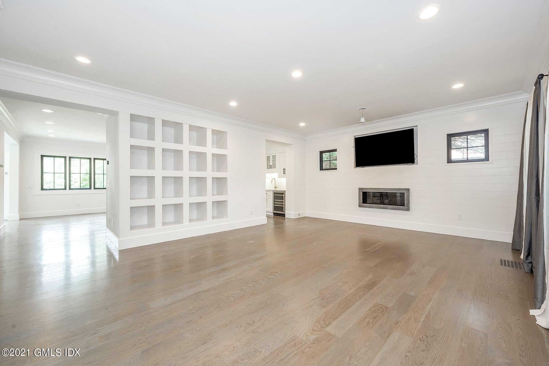 22 Wescott Street Riverside, CT 06878 - Photo 5 of 37 a view of a livingroom with wooden floor and a flat screen tv