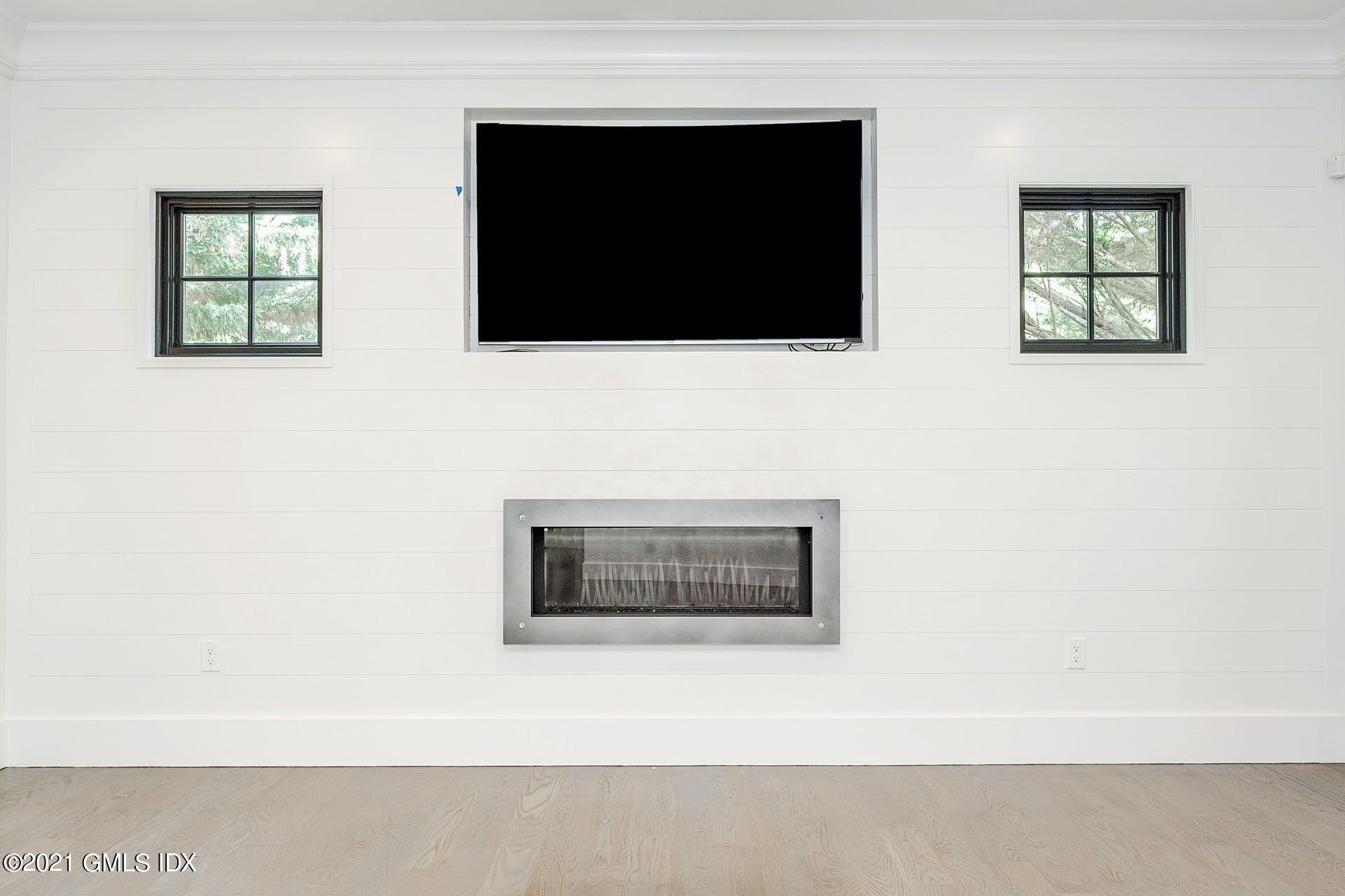 22 Wescott Street Riverside, CT 06878 - Photo 6 of 37 a living room with a flat screen tv and a fireplace