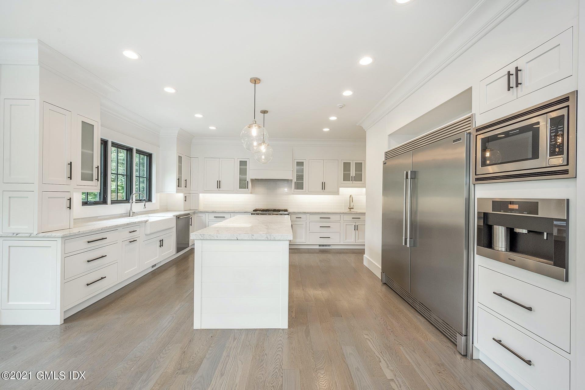 22 Wescott Street Riverside, CT 06878 - Photo 10 of 37 a kitchen with white cabinets and stainless steel appliances
