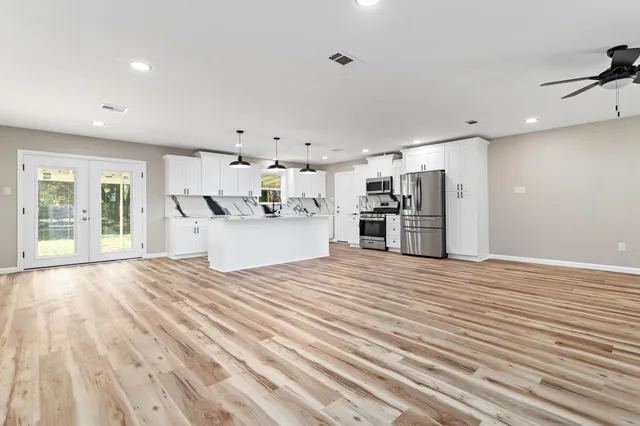 a view of a kitchen with a dishwasher and a refrigerator