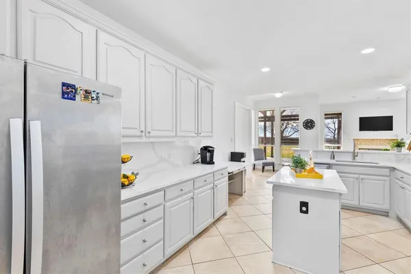a kitchen with cabinets and window
