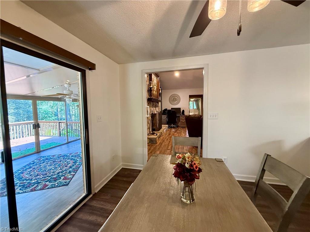 7352 Oak Bucket Road Thomasville, NC 27360 - Photo 11 of 38 Dining room connecting to the sunroom and living room.